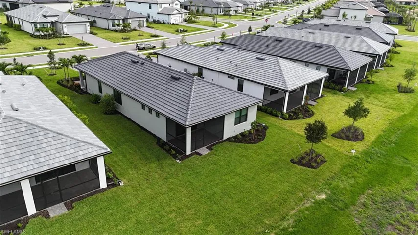 Row of properties featuring tiled roofs and screened patios