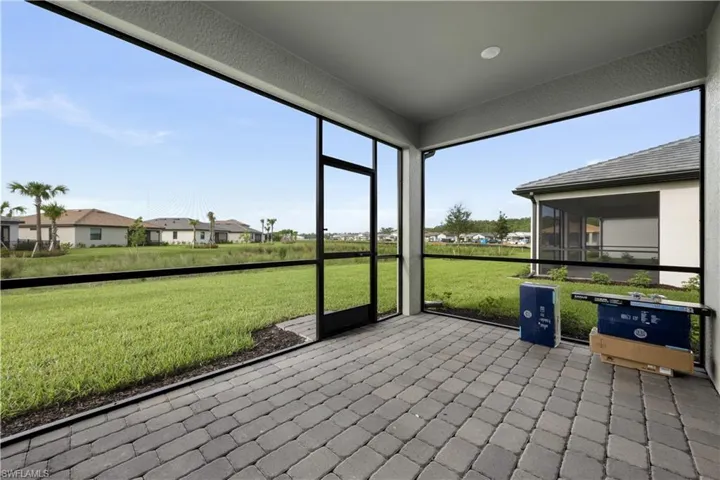 Screened patio featuring paver flooring, a flat ceiling, and recessed lighting