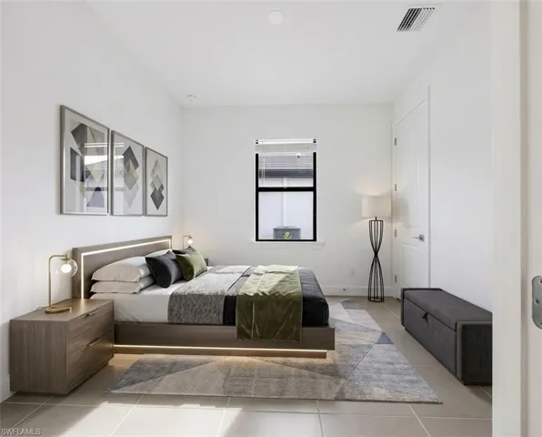 *Virtually Staged*Bright room featuring light-toned flooring, a single window with blinds, and white walls