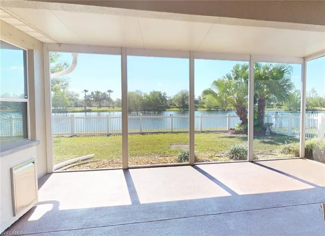 Unfurnished sunroom featuring a water view