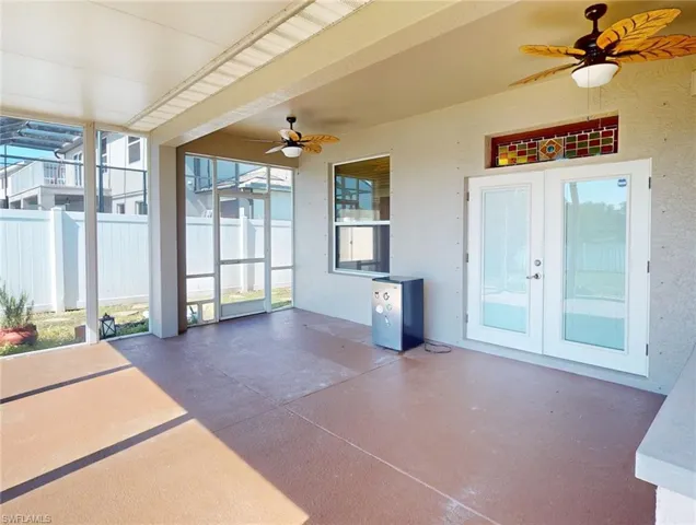View of terrace with ceiling fan and french doors