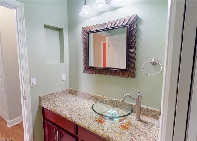 Bathroom featuring wood-type flooring and vanity