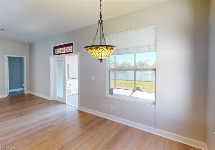 Empty room with light hardwood / wood-style floors