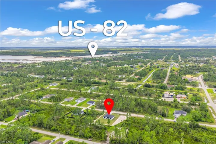 View of property location featuring nearby suburban area and a nearby body of water