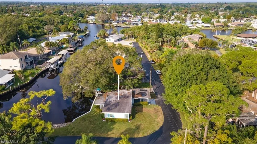 Aerial view of residential area featuring a large body of water
