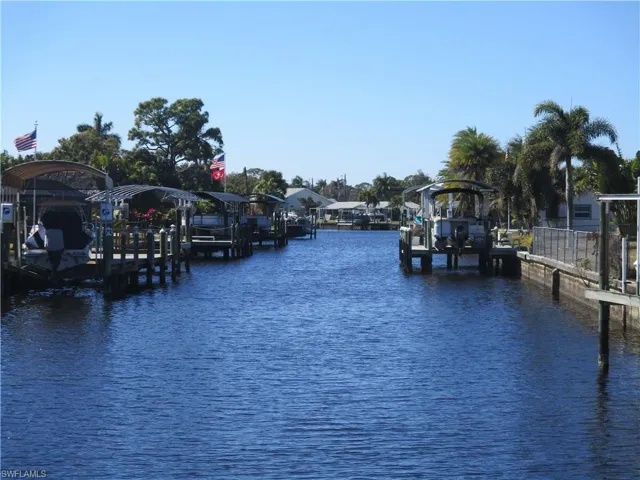 Dock featuring a water view and boat lift