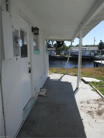 View of patio / terrace featuring a water view