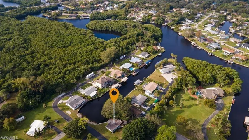 Aerial view of residential area featuring a large body of water
