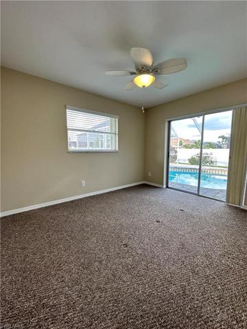 Bedroom "B" has sliding glass doors going to pool area