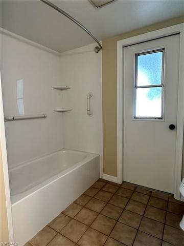 2nd bathroom tub & shower combo with grab bars