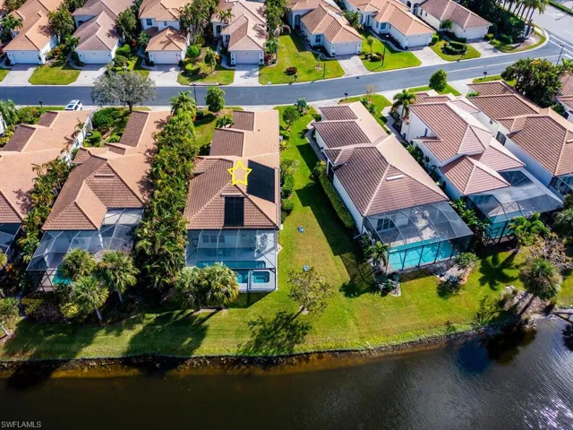 Birds eye view of property showing spacious side yard