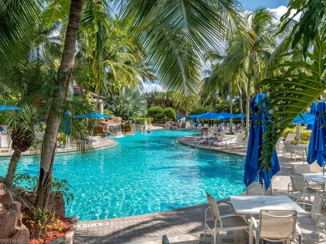 View of pool featuring pool water feature and a patio area