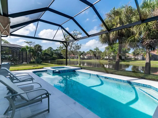 Another outdoor view showing large side yard and picture frame screen all the way around the pool