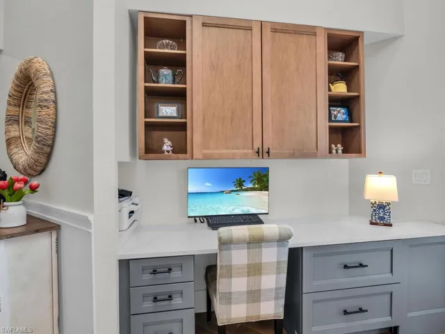 Office area featuring built in desk, which can double as a dining room buffet
