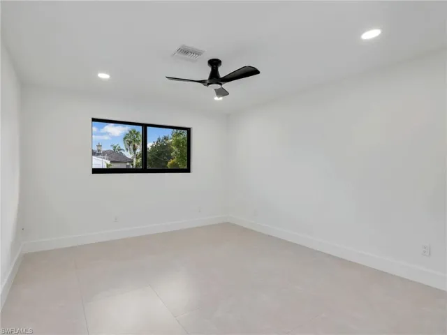 Unfurnished room with a ceiling fan, recessed lighting, and light tile patterned flooring