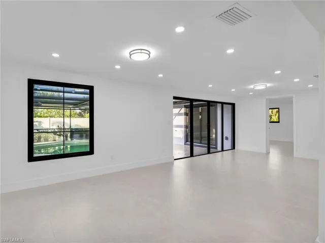 Unfurnished room with plenty of natural light, recessed lighting, and light tile patterned floors