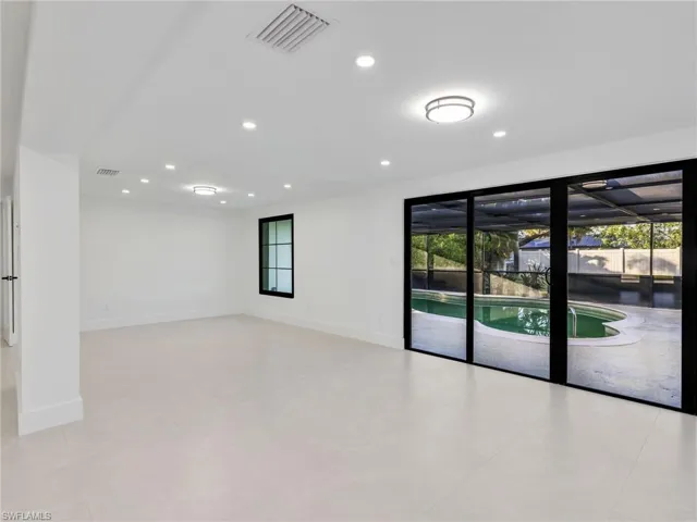 Spare room with healthy amount of natural light and recessed lighting