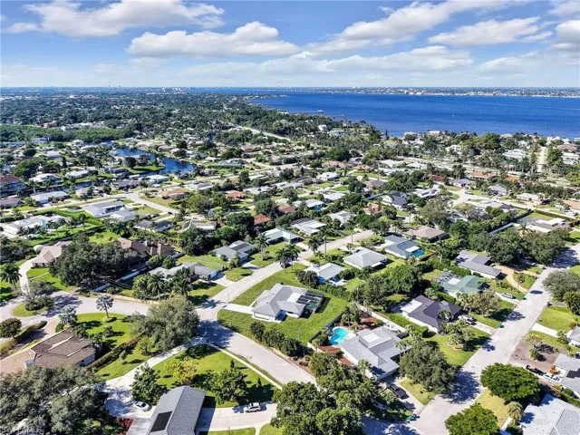 Aerial overview of property's location with nearby suburban area