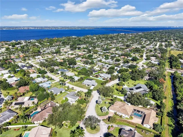 View of property location with nearby suburban area