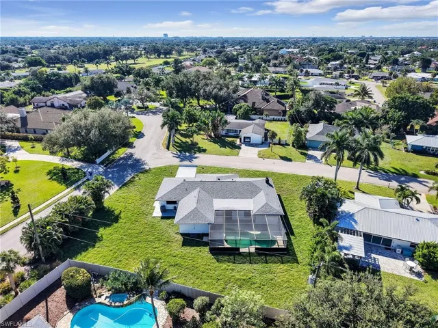 Aerial perspective of suburban area featuring a pool area