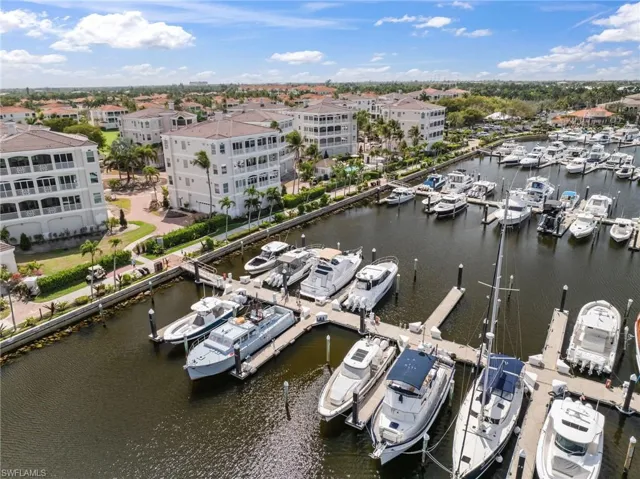 Aerial view of a nearby body of water and numerous boat docks