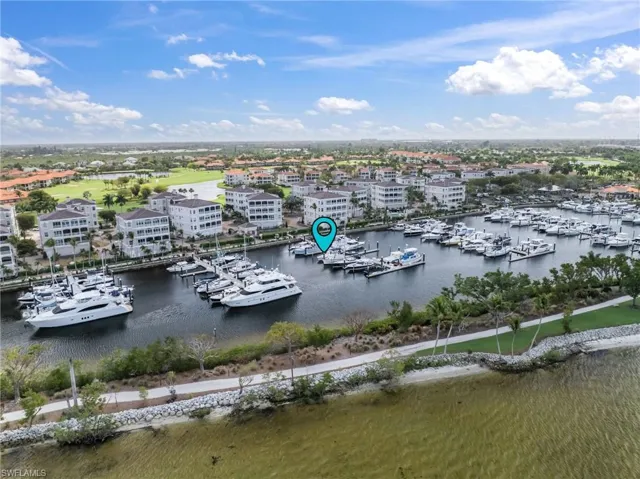 Drone / aerial view of a marina and a nearby body of water