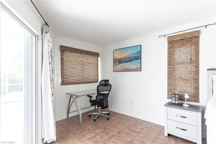 Office featuring baseboards and light tile patterned floors