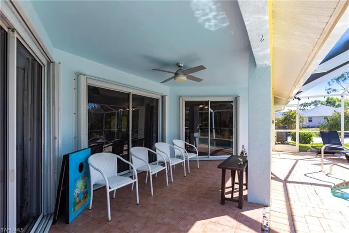 View of patio featuring ceiling fan