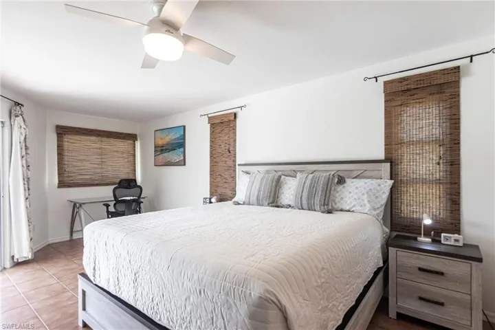 Bedroom featuring tile patterned floors and ceiling fan