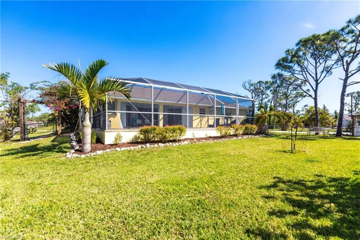 Rear view of house with a lanai