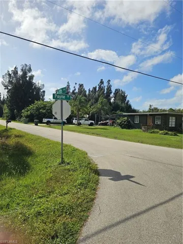 View of asphalt street with traffic signs