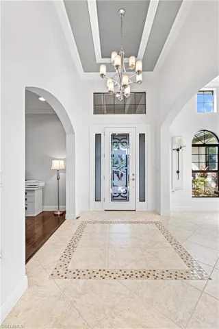 ENTRANCE TO YOUR BEAUTIFUL NEW HOME HERE IN PARADISE! BEAUTIFUL CUSTOM GLASS DOOR & SPARKLING DECORATIVE TILE FLOORING.