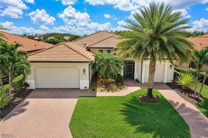 TOTALLY UPDATED BORETTO MODEL ESTATE HOME ON SOLARO IN PELICAN PRESERVE WITH AN AMAZING LAKE VIEW!
