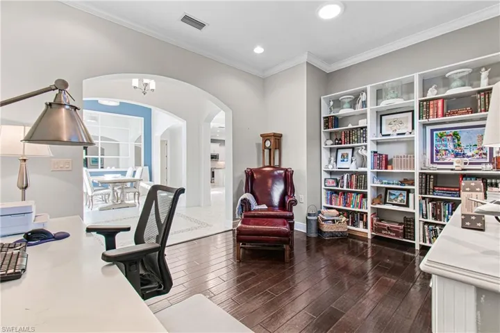 OVERSIZED DEN/OFFICE WITH BEAUTIFUL TRUE WOOD FLOORS & DEFINITELY LARGE ENOUGH TO EASILY BE CONVERTED INTO A 4TH BEDROOM IF DESIRED. CUSTOM MADE WOOD WINDOW SHUTTERS PLUS A SOLAR-TUBE LIGHTING DEVICE!