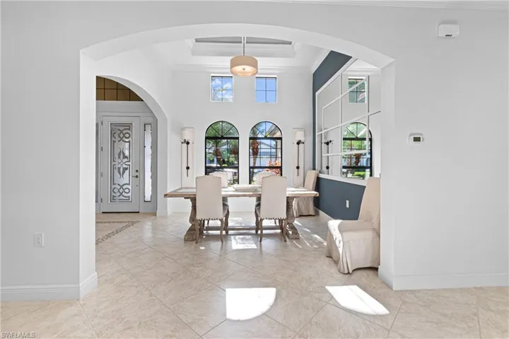 INSIDE OF HOME HAS RECENTLY BEEN PROFESSIONALLY PAINTED! DINING AREA IS PERFECT FOR ENTERTAINING ALL FAMILY & FRIENDS WITH A COFFERED CEILING & DECORATIVE CUSTOM MIRRORED WALL.