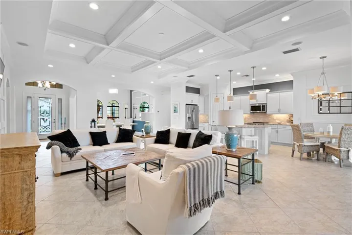 TOTALLY OPEN CONCEPT WITH UPGRADED LIGHTING WITH 7+ INCH CROWN MOLDING & 14 FOOT CEILINGS. THIS IS TRULY YOUR DREAM HOME! EVEN MORE BEAUTIFUL IN PERSON. HUGE BONUS: THE 2 HIGH-END SOFAS & COFFEE TABLE REMAIN WITH THE HOME!