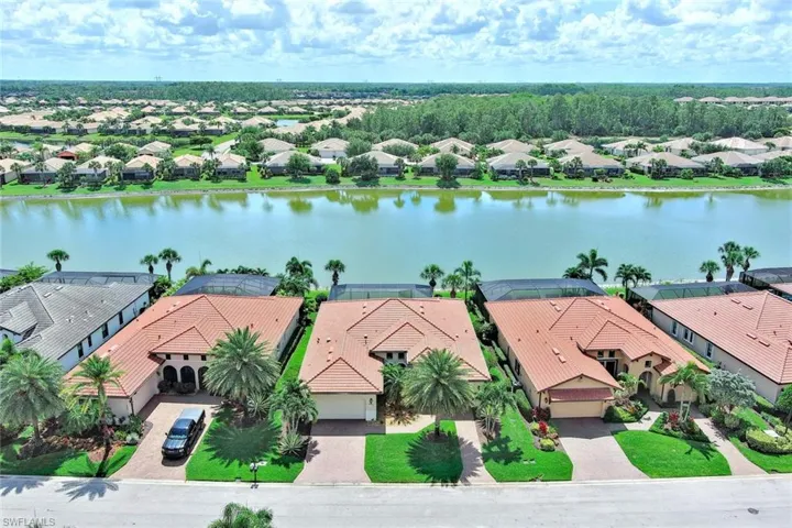 LAKE VIEW PLUS AN OVERSIZED 2 CAR GARAGE & A GOLF CART GARAGE WITH A CONVENIENT OUTSIDE SIDE ENTRY DOOR.