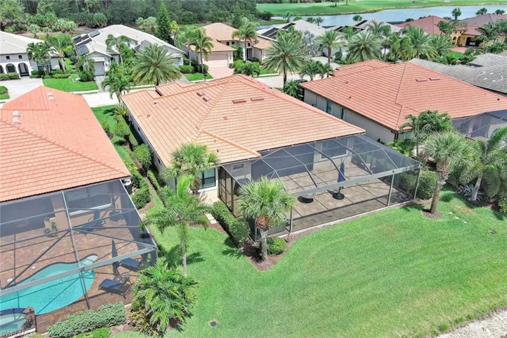 GREAT VIEW OF THE POOL THAT WAS INSTALLED NEXT DOOR. MANY RESIDENTS PREFER TO PUTTING IN THEIR OWN MODERN UP TO DATE POOL INSTEAD OF AN ORIGINAL BUILDERS GRADE POOL.