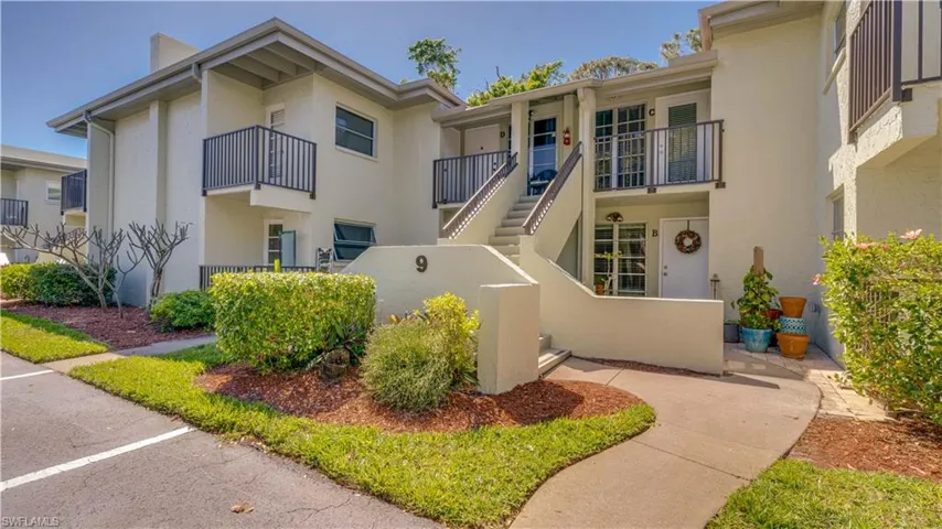 View of front of property with a fenced front yard and stucco siding