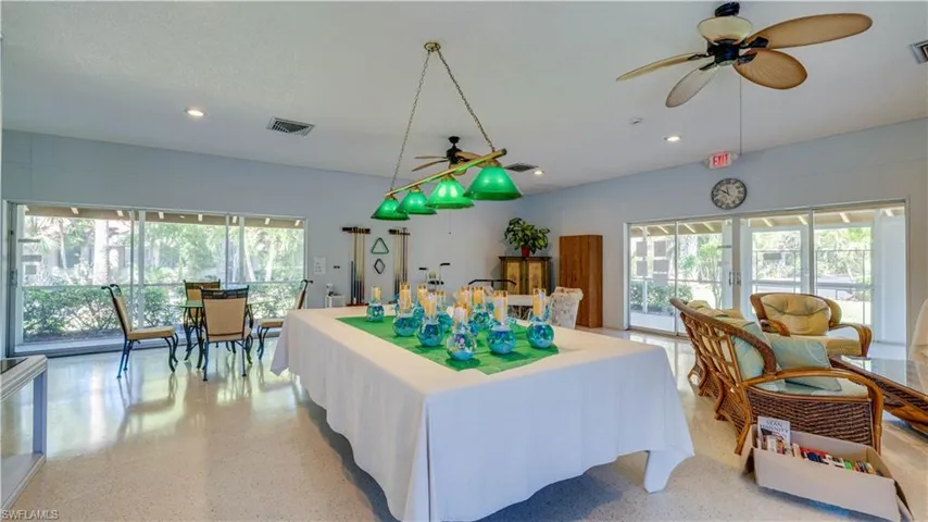 Recreation room with recessed lighting, light speckled floor, visible vents, and french doors