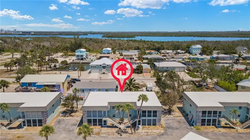 Drone view of front of unit, 4 units to building, total of 9 buildings or 36 units to complex