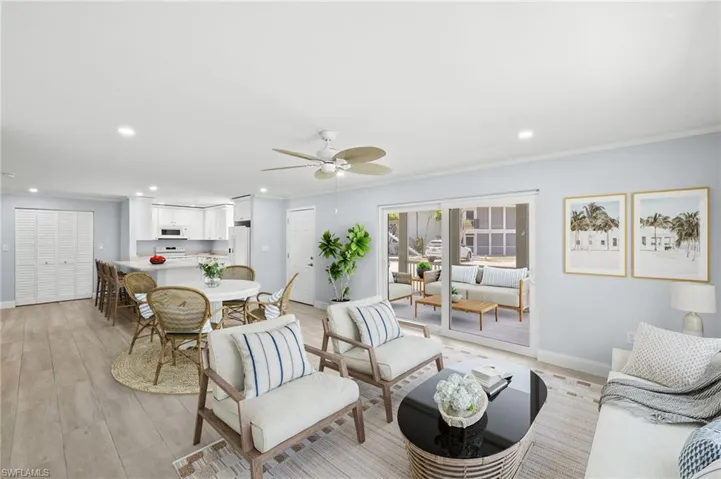 Virtual Imaging Living room with baseboards, crown molding, ceiling fan, recessed lighting, and light wood-style ceramic flooring