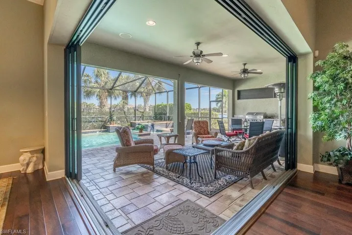 Sunroom / solarium featuring ceiling fan