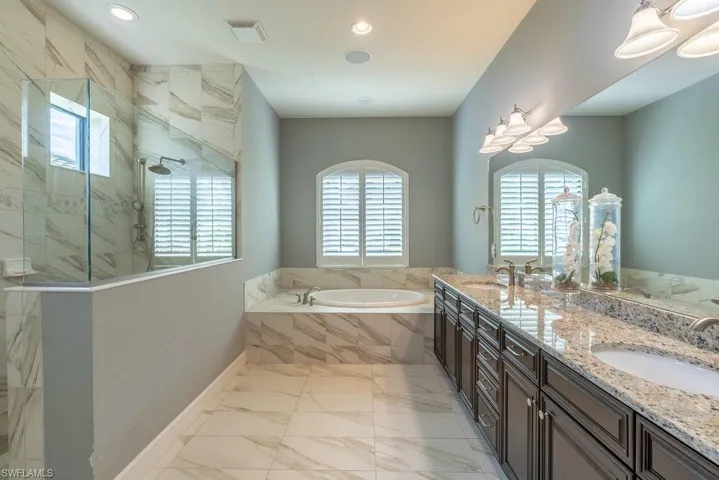 Bathroom with vanity and independent shower and bath