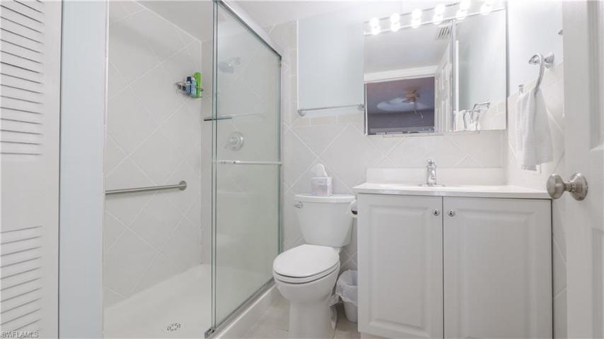 Master bathroom w/custom tile, doors, higher vanity and toilet.