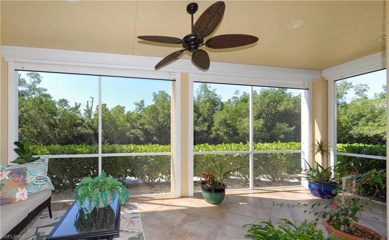 Large screened Lanai with tiled floor. Features Peaceful Private Views of the Stream and Preserve!