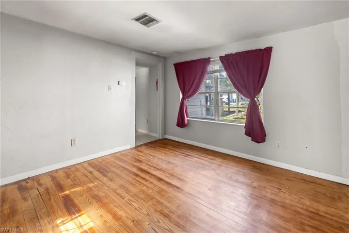 Living Room in guest home with original wood floors.