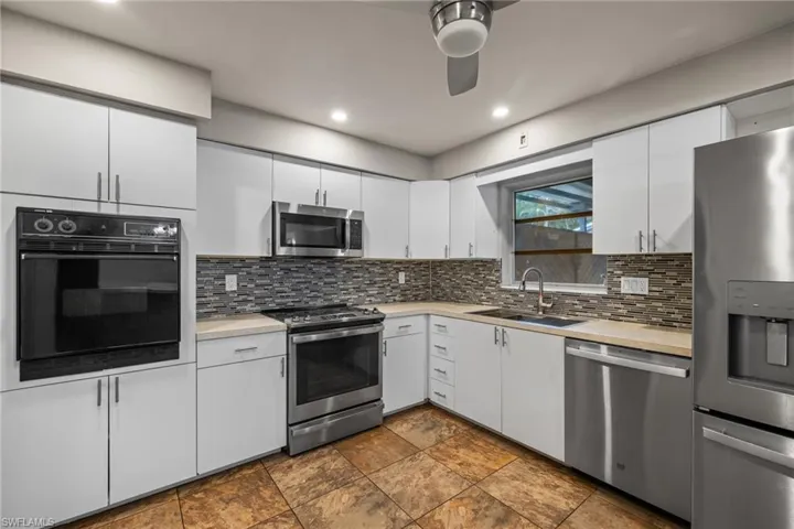 Beautiful kitchen with range and wall oven.