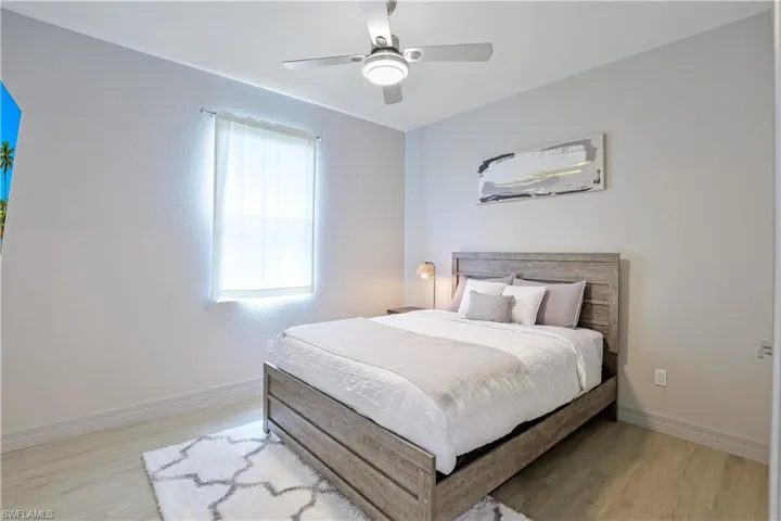 Bedroom featuring light wood-style flooring and ceiling fan