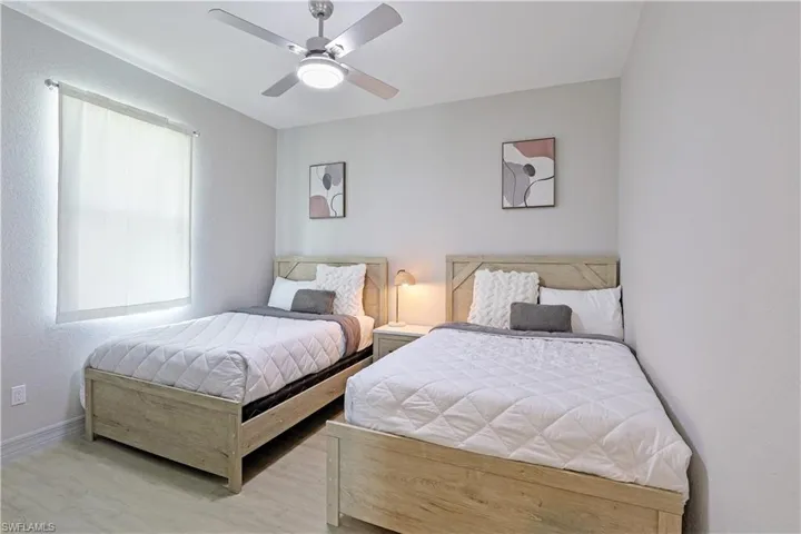 Bedroom featuring wood finished floors and ceiling fan